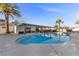 Backyard pool with ample patio space, covered area, and palm trees, perfect for outdoor relaxation and entertaining at 2885 Horseshoe Dr, Las Vegas, NV 89120