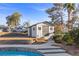 Charming backyard shed with white stone exterior and a stone-lined walkway leading up to it at 2885 Horseshoe Dr, Las Vegas, NV 89120