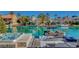 Backyard featuring boat dock, hot tub, outdoor seating, and views of calm lake at 3111 Lido Isle Ct, Las Vegas, NV 89117