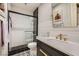 Modern bathroom with a glass enclosed shower, black and white geometric flooring, and sleek vanity at 3111 Lido Isle Ct, Las Vegas, NV 89117
