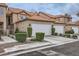 Charming townhome with a two-car garage and manicured landscaping at 3111 Lido Isle Ct, Las Vegas, NV 89117
