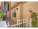 Inviting entryway with white picket fence, tall arched window, and stucco exterior at 3111 Lido Isle Ct, Las Vegas, NV 89117