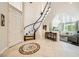 Elegant foyer with marble tile flooring, grand staircase, and soaring ceilings at 3111 Lido Isle Ct, Las Vegas, NV 89117