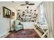 Bright office space with a large bookcase, comfortable armchair, desk, and natural light from the window at 3111 Lido Isle Ct, Las Vegas, NV 89117