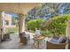 Comfortable outdoor seating area, nestled on a covered patio, surrounded by landscaped foliage at 3111 Lido Isle Ct, Las Vegas, NV 89117