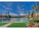 Scenic waterfront view with docks, boats, palm trees, and mountain backdrop at 3111 Lido Isle Ct, Las Vegas, NV 89117