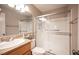 Bathroom featuring a toilet, sink, and glass enclosed shower with silver hardware at 3151 Soaring Gulls Dr # 1181, Las Vegas, NV 89128