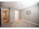 Neutral bedroom with an open closet and doorway showing hard flooring in the next room at 3151 Soaring Gulls Dr # 1181, Las Vegas, NV 89128