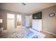 Relaxing bedroom featuring a dresser, TV, and two entrances at 3151 Soaring Gulls Dr # 1181, Las Vegas, NV 89128
