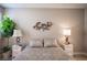 Serene bedroom featuring a comfortable bed, ambient lighting, and decorative wall art at 3151 Soaring Gulls Dr # 1181, Las Vegas, NV 89128