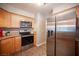 Modern kitchen features stainless steel appliances, wood cabinets, and stylish lighting at 3151 Soaring Gulls Dr # 1181, Las Vegas, NV 89128