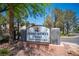 Sign that reads Desert Shores Villas Condominiums surrounded by trees and greenery at 3151 Soaring Gulls Dr # 1181, Las Vegas, NV 89128