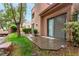 This cozy backyard features a small patio and mature landscaping that offers privacy and shade at 3246 Brookfield Dr, Las Vegas, NV 89120