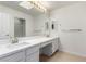 Bright bathroom with double sinks, marble countertops, and modern lighting at 3246 Brookfield Dr, Las Vegas, NV 89120