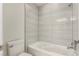 Tiled bathtub and shower combo with a white toilet at 3246 Brookfield Dr, Las Vegas, NV 89120
