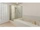 A bathroom showcasing a separate shower, jacuzzi tub, and a glass block window at 3246 Brookfield Dr, Las Vegas, NV 89120