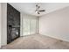 The bedroom boasts a dark stone fireplace and a sliding glass door leading to the backyard at 3246 Brookfield Dr, Las Vegas, NV 89120