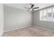 Bedroom features neutral walls, carpet, ceiling fan, and plantation shutters at 3246 Brookfield Dr, Las Vegas, NV 89120