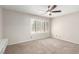 Neutral bedroom featuring plantation shutters and a ceiling fan at 3246 Brookfield Dr, Las Vegas, NV 89120