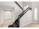 Elegant foyer featuring a black-railed staircase and wood-look floors at 3246 Brookfield Dr, Las Vegas, NV 89120