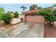 Single-Gathering home featuring a two-car garage with a tidy driveway at 3246 Brookfield Dr, Las Vegas, NV 89120