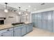 The kitchen island features granite countertops and gas cooktop adjacent to living room fireplace at 3246 Brookfield Dr, Las Vegas, NV 89120