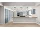 This kitchen features a long island with storage on both sides, stainless appliances, and sleek blue cabinets at 3246 Brookfield Dr, Las Vegas, NV 89120