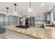 Spacious kitchen island with granite countertop, cooktop and stainless steel appliances at 3246 Brookfield Dr, Las Vegas, NV 89120