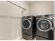 Laundry room with full-sized, front-loading washer and dryer at 3246 Brookfield Dr, Las Vegas, NV 89120
