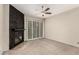 The cozy living room has a black stone fireplace and sliding doors leading to the outside at 3246 Brookfield Dr, Las Vegas, NV 89120