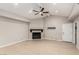 Spacious living room featuring light wood-look floors, a fireplace and bright light at 3246 Brookfield Dr, Las Vegas, NV 89120