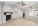 Bright living room features a fireplace, access to laundry, and large windows allowing natural light at 3246 Brookfield Dr, Las Vegas, NV 89120