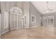Bright and airy living space featuring vaulted ceilings, plantation shutters and light floors at 3246 Brookfield Dr, Las Vegas, NV 89120