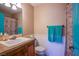 Stylish bathroom with wainscoting and decorative mirror at 3249 Dayflower St # C, Las Vegas, NV 89121