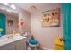 Charming powder bathroom with decorative mirror and vibrant accents at 3249 Dayflower St # C, Las Vegas, NV 89121