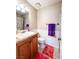 Bathroom showcasing a vanity, toilet, and shower with a shower curtain at 3249 Dayflower St # C, Las Vegas, NV 89121