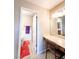 Bathroom with a vanity, mirror, and tile flooring leading to a shower at 3249 Dayflower St # C, Las Vegas, NV 89121