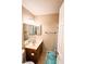 Bright bathroom featuring a vanity with a mirror and a shower with a shower curtain at 3249 Dayflower St # C, Las Vegas, NV 89121