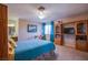 Bright bedroom featuring an entertainment center and adjacent desk area at 3249 Dayflower St # C, Las Vegas, NV 89121