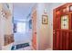 Bright foyer with a welcoming entrance, coat hooks, and an open view into the living area at 3249 Dayflower St # C, Las Vegas, NV 89121