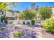Inviting front yard with manicured landscaping and a charming brick pathway to the house at 3249 Dayflower St # C, Las Vegas, NV 89121