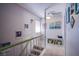 Hallway with staircase and decorative artwork at 3249 Dayflower St # C, Las Vegas, NV 89121