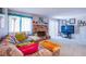 Comfortable living room featuring a brick fireplace and sliding glass doors to the exterior at 3249 Dayflower St # C, Las Vegas, NV 89121