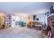 Open-concept living room with a fireplace, dining area, and adjacent kitchen at 3249 Dayflower St # C, Las Vegas, NV 89121