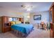 Spacious bedroom includes furnishings at 3249 Dayflower St # C, Las Vegas, NV 89121