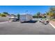 Spacious parking area with a trailer and boat parking available in a well-maintained community with tennis court at 3249 Dayflower St # C, Las Vegas, NV 89121