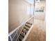 Carpeted stairway with white railing leading to the upper level at 3249 Dayflower St # C, Las Vegas, NV 89121