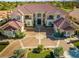 Overhead view of home and lush landscaping and circular driveway at 35 Ventana Canyon Dr, Las Vegas, NV 89113