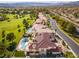 Beautiful aerial shot featuring a pool and well-kept landscaping in a neighborhood with mature trees and green spaces at 35 Ventana Canyon Dr, Las Vegas, NV 89113