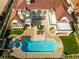 Stunning aerial view showcasing a luxury home with a pool, manicured grounds, and elegant outdoor living spaces at 35 Ventana Canyon Dr, Las Vegas, NV 89113